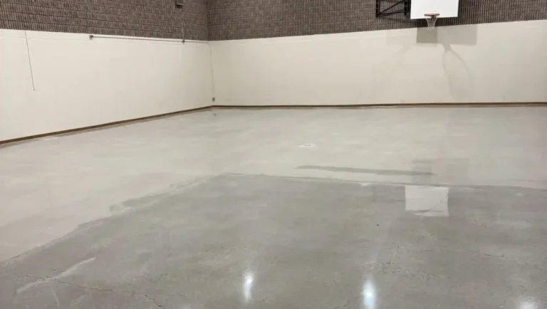 Professional polished concrete floor installation with high gloss finish designed for garages basements and commercial buildings
